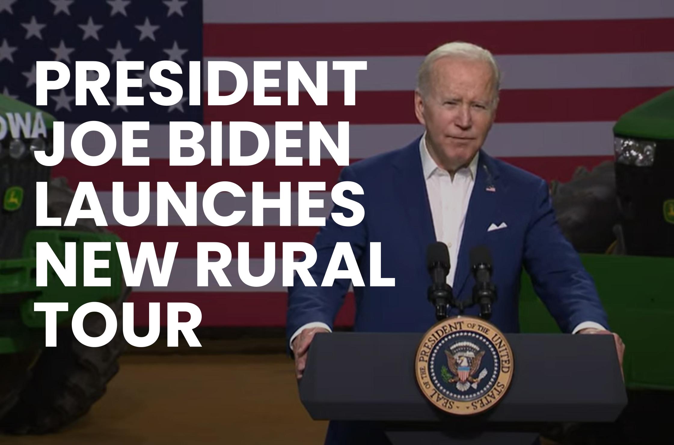 President Joe Biden stands at a podium in a blue suit and white shirt with noe tie. Text on the left side of image reads, "PRESIDENT JOE BIDEN LAUNCHES NEW RURAL TOUR"