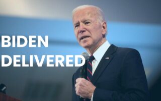 President Biden holding a microphone with a blurred background. Text on the image reads, BIDEN DELIVERED